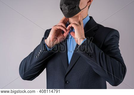 Office Worker With Coronavirus Symptoms On Gray Background