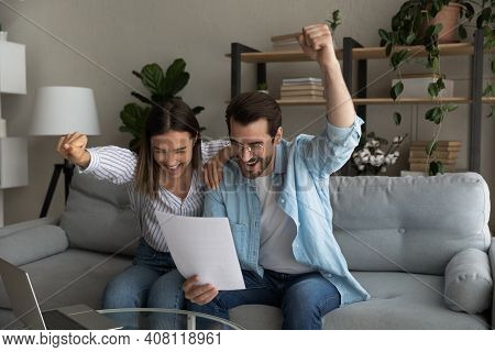 Excited Young Married Couple Getting Money Grant For Family Business