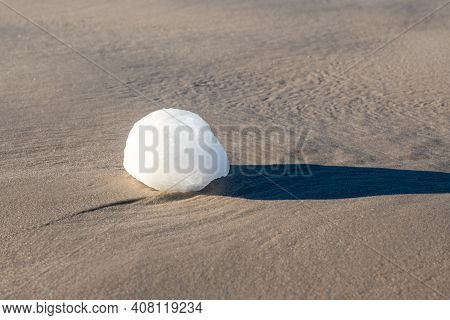 Ice Ball On The Beach During Winter. Debki Village, Baltic Sea, Poland