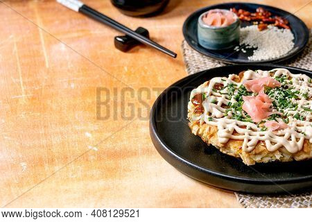 Homemade Japanese Fast Food Okonomiyaki Cabbage Pancake Decorated By Spring Onion, Pickled Ginger, M