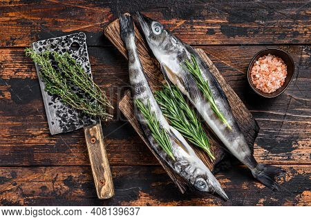 Whole Fresh Raw Icefish On A Wooden Cutting Board. Wooden Background. Top View
