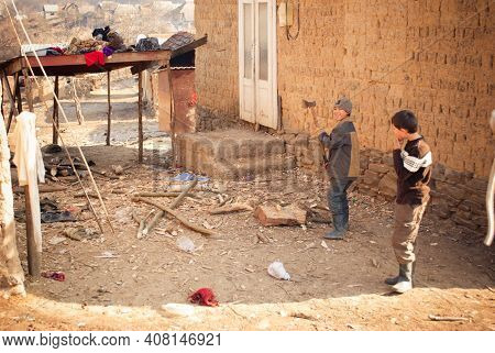 Serednie, Ukraine - March 09, 2011: Kids Performing Adult Chores And Reponsibilities