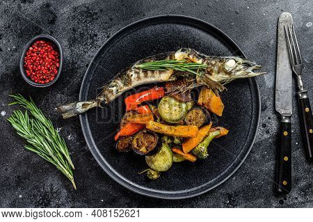 Baked Whole Icefish With Grilled Vegetables. Black Background. Top View