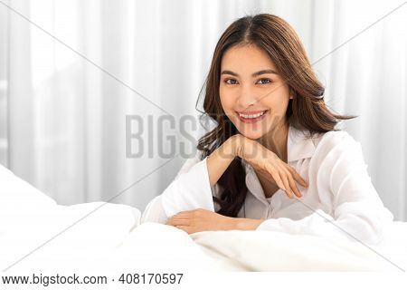 Portrait Of Smiling Cheerful Beautiful Pretty Asian Woman Clean Fresh Healthy White Skin Posing In P