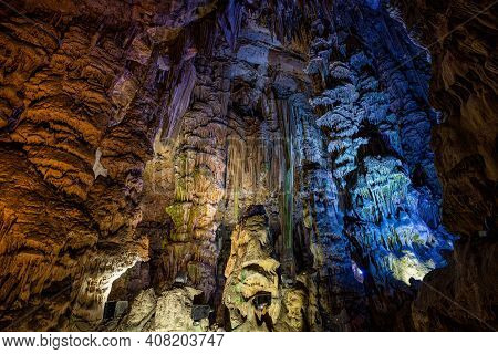 Upper Rock Nature Reserve At Gibraltar. Exploring Old St. Michaels Cave, That Has Been Illuminated W