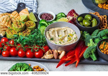 Vegan Charcuterie Board. Vegetarian Appetizers Board With Hummus, Bread Snacks, Vegetables, Falafel,