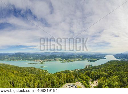 Aerial View Of The Alpine Lake Worthersee, Famous Tourist Attraction For Many Water Activity In Klag