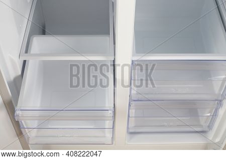 Home Appliance - Inside Closeup Open Two-door White Refrigerator Freeze And Fresh Zone