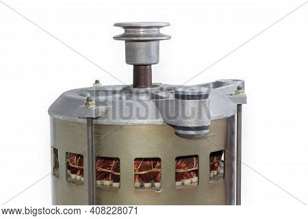 Fragment Of Electric Motor With  Pulley, Visible Windings In Ventilation Holes In The Housing And Sh