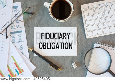 Fiduciary Obligation Is Written In A Document On The Office Desk With Office Accessories, Diagram An