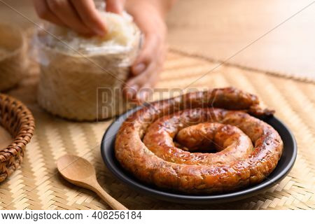 Northern Thai Sausage (sai Aua), Grilled Intestine Stuffed With Minced Pork, Spices And Herbs Eating