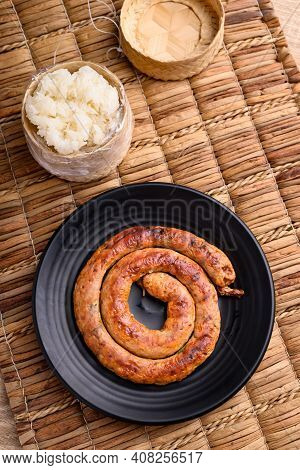 Northern Thai Sausage (sai Aua), Grilled Intestine Stuffed With Minced Pork, Spices And Herbs Eating