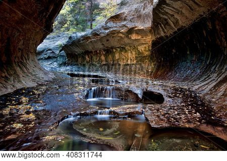 Small cascades and pools at the entrance to the Subway, a unique tunnel scuplted by the Left Fork of North Creek in Zion National Park, Utah