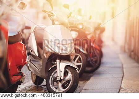 Set Of Motorbikes For Rent Parked On Street, Parking For Sharing