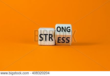 Strong Stress Symbol. Turned Wooden Cubes With Words 'strong Stress'. Beautiful Orange Background, C