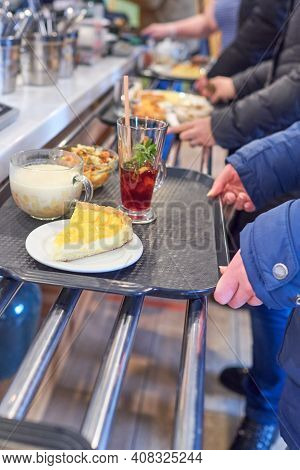 The Queue At The Checkout In The Gastronomic Cafe. Distribution Line In The Dining Room. Trays With 