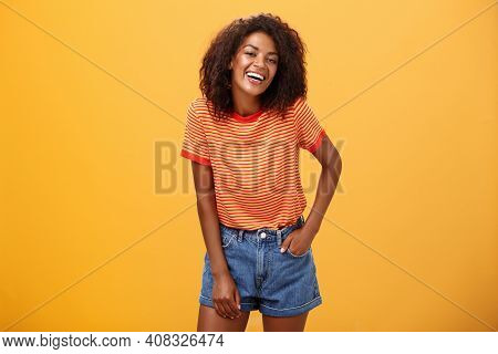 Portrait Of Charismatic Charming African American Stylish African American Female In Trendy Shorts A