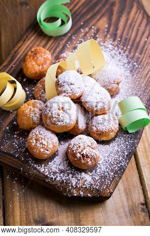 Baked Castagnole With Powdered Sugar And Confetti. Street Food, Round Biscuits With Sugar For The Ca
