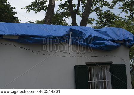 Storm Damage, Broken House Roof, Provisional Fixed With A Plane