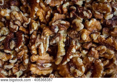 Top View Of Deshelled Walnuts. Use For Healthy Food Concept