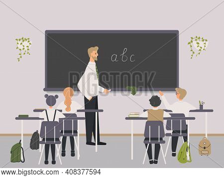 Male Teacher Of Philology Explaining English Letters To Elementary School Pupils Or Children Near Ch