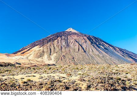 Silhouette Of Volcano Del Teide Against  Blue Sky. Pico Del Teide Mountain In El Teide National Park