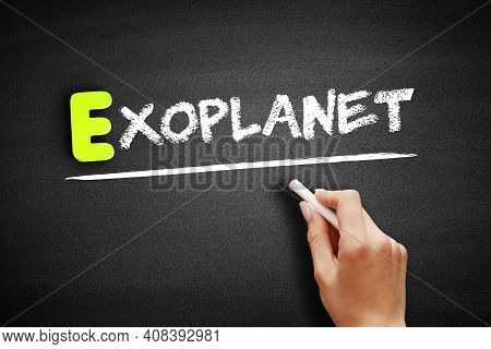 Hand Writing Exoplanet On Blackboard, Concept Background