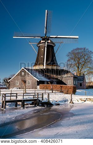 Pelmolen Ter Horst, Rijssen Covered In Snowy Landscape In Overijssel Netherlands, Historical Wind Mi