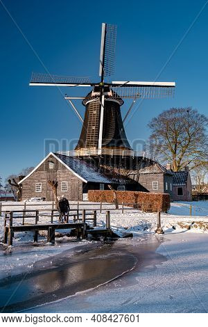 Pelmolen Ter Horst, Rijssen Covered In A Snowy Landscape Overijssel Netherlands, Historical Wind Mil