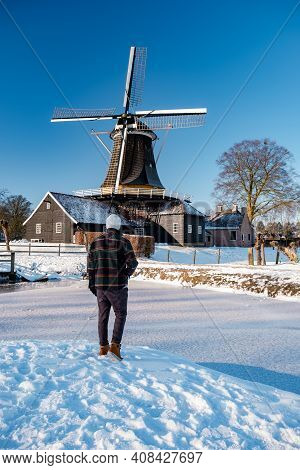 Pelmolen Ter Horst, Rijssen Covered In A Snowy Landscape Overijssel Netherlands, Historical Wind Mil