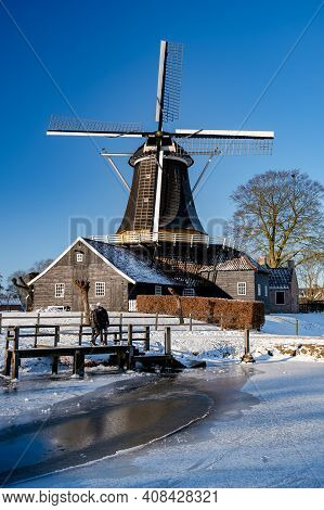 Pelmolen Ter Horst, Rijssen Covered In A Snowy Landscape Overijssel Netherlands, Historical Wind Mil