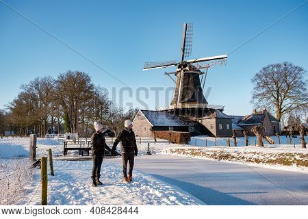 Pelmolen Ter Horst, Rijssen Covered In A Snowy Landscape Overijssel Netherlands, Historical Wind Mil