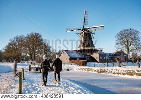 Pelmolen Ter Horst, Rijssen Covered In A Snowy Landscape Overijssel Netherlands, Historical Wind Mil
