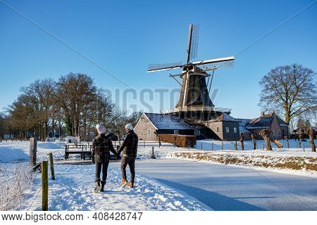 Pelmolen Ter Horst, Rijssen Covered In A Snowy Landscape Overijssel Netherlands, Historical Wind Mil