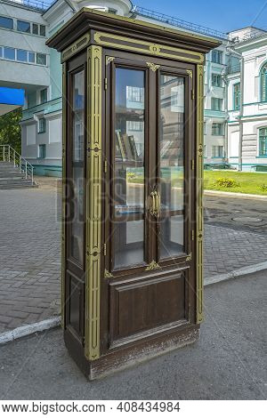 Tomsk, Russia-30 August 2020:  Bookcrossing Cabinet Near The Historical Building Of The Scientific L
