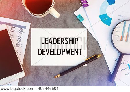 Leadership Development Is Written In A Document On The Office Desk With Office Accessories, Coffee, 