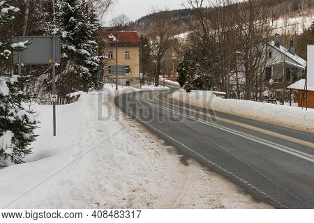 Asphalt Road In Winter, In The Jizera Mountains.
Jizera Mountains In Poland. Asphalt Road Covered Wi