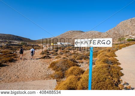 Folegandros, Greece - September 25, 2020: Tourists On The Path To Katergo Beach, One Of The Most Bea