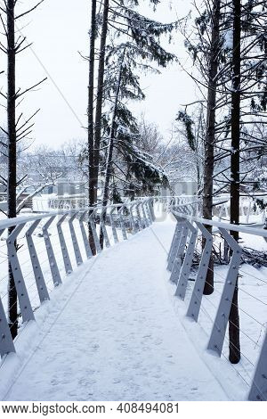 Cherkasy, Ukraine, January 2021. Metal New Beautiful Bridge In The Zoo Of Cherkasy City In Snowy Win
