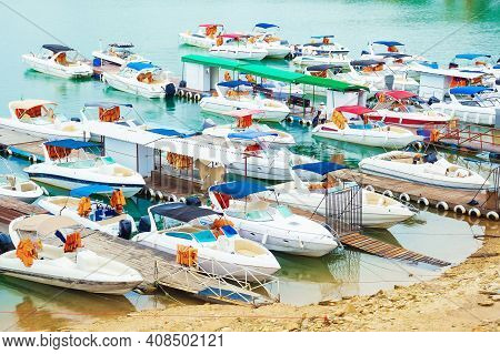 Many Tourist Speed Boats Docked At Port. Boat Rides Tourist Spot.