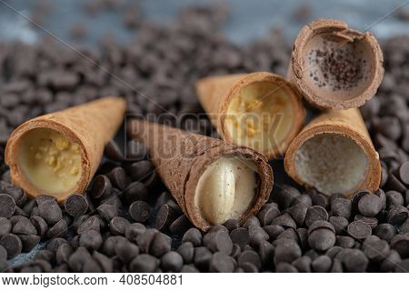Sweet Conus Candies On Chocolate. Brown Background