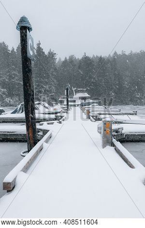 Snow On A Dock In A Marina On A Winter Day On Vancouver Island, British Columbia, Canada
