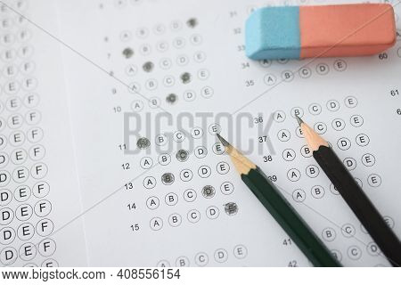 On Table Is Test With Options For Answer Pencils And Wash. Rapid Iq Test