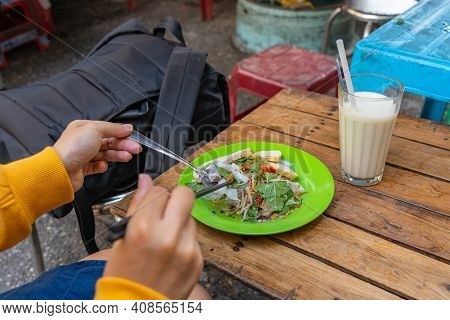 Female Traveller Eating Vietnamese Street Food - Banh Cuon
