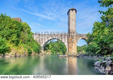 Orthez, France. View Of Old Stone Roman Bridge Over Ousse River