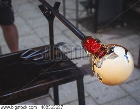 Glass-blower Artist Create White Glass Layer On Transparent Glass Bowl. Man Working With Hot  Glass 