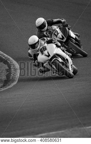 A Shot Of A Racing Motorbike As It Circuits A Track.