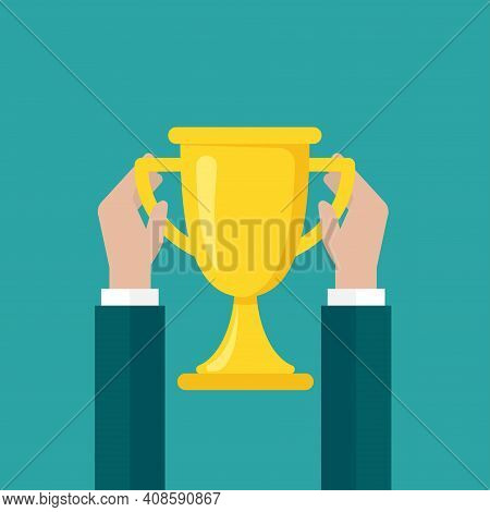 Hands With Gold Trophy, Winning Cup Isolated On Blue Background. First Place, Award Bowl. Symbol Of 