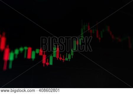 Chart Stock Trading On A Black Background Of The Monitor.