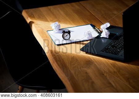 Modern Workplace, Wooden Office Desk In Hardlight, Sunligt With Clock, Sheet Of Paper